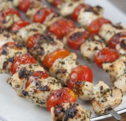 Super easy, healthy restaurant-quality Grilled Pesto Chicken and Tomato Kabobs recipe for summer grilling and entertaining!