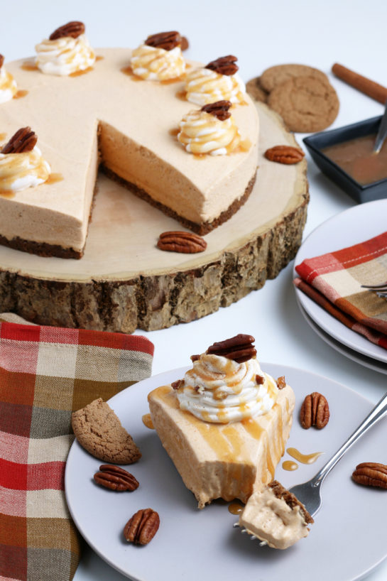 Smooth and creamy No Bake Pumpkin Cheesecake with extra spiced flavor and gingersnap crust. It is a fool proof recipe because it turns out amazing every time! This is the perfect Thanksgiving or Christmas dessert!