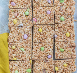 Photo of the cut-up Mini Egg Rice Krispie Treats that are a deliciously addictive dessert recipe for Easter! They’re super easy and fun to make with kids. The perfect Easter sweet treat!